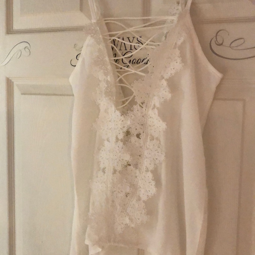Lacy strappy  tank top. Beautifully tasteful